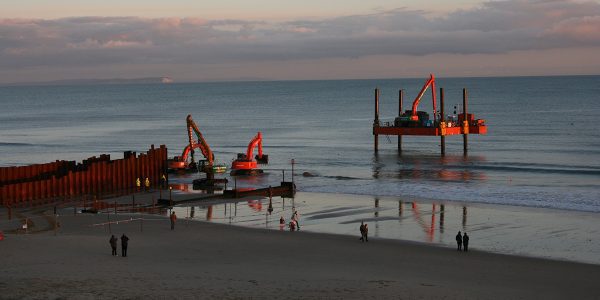 Construction of cofferdam at sea