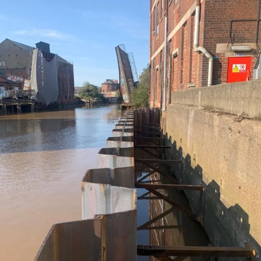 Steel sheet piles installed in front of the existing river wall at Hull